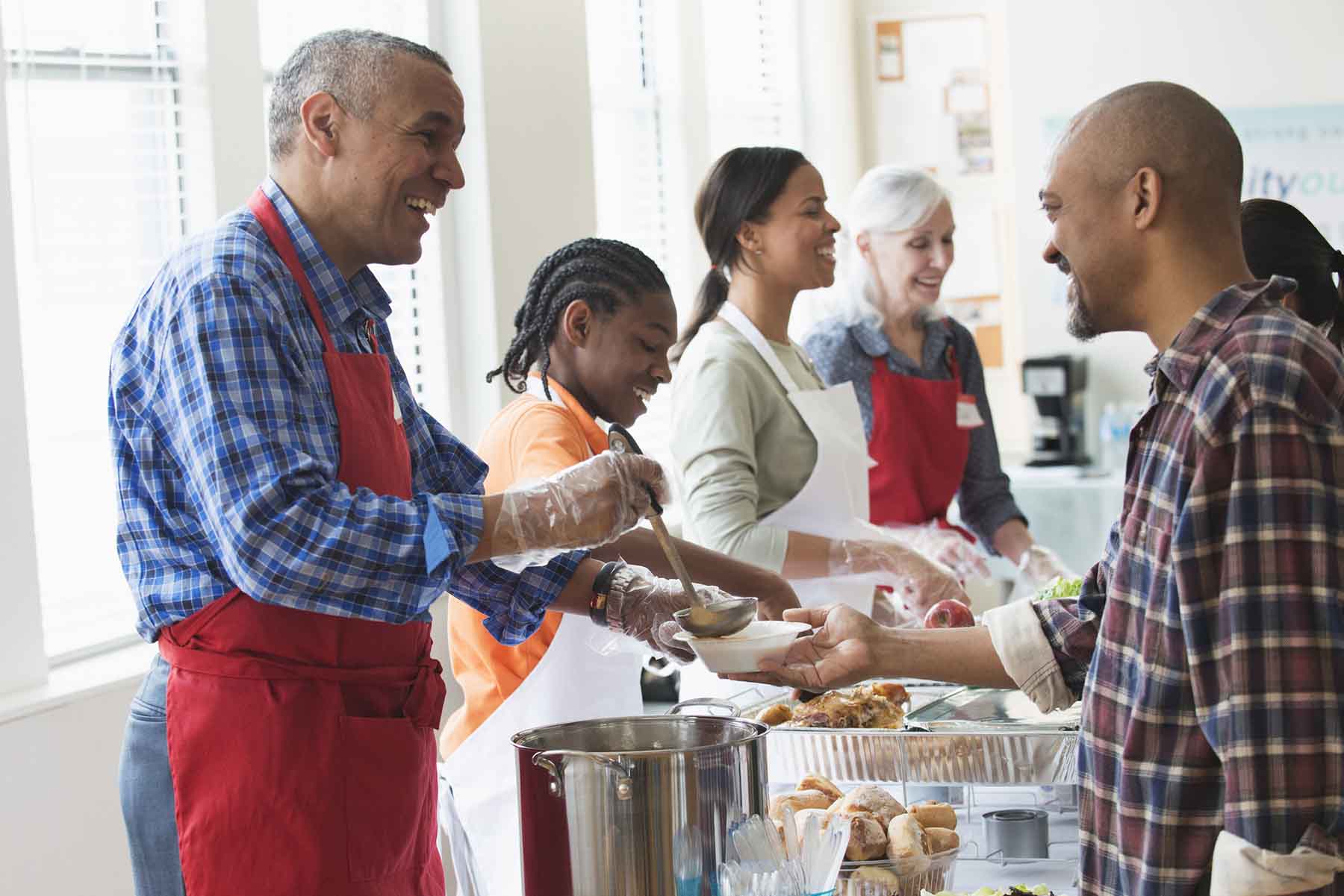 Volunteers working in a soup kitchen