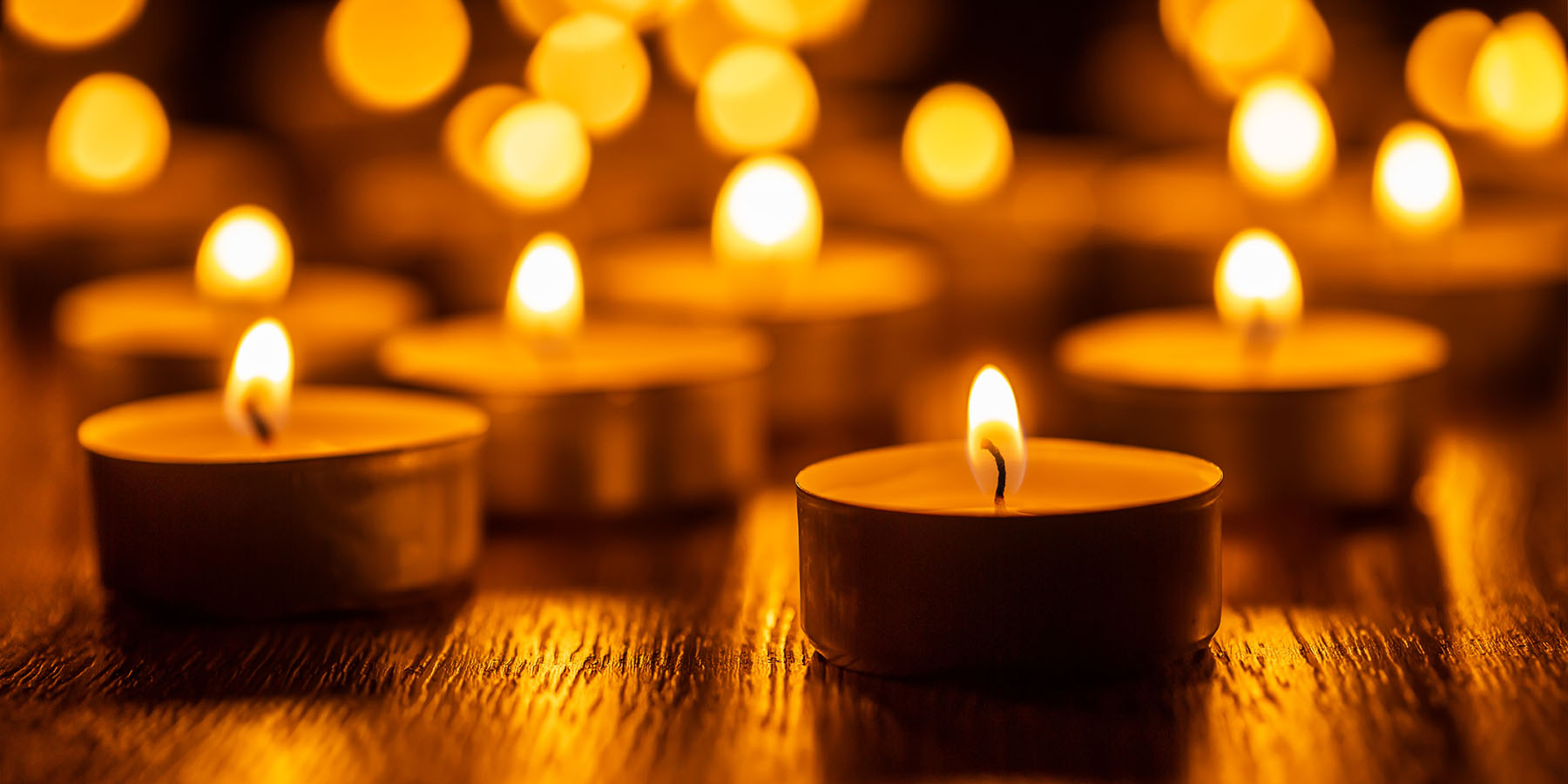 Lit candles in a dark space