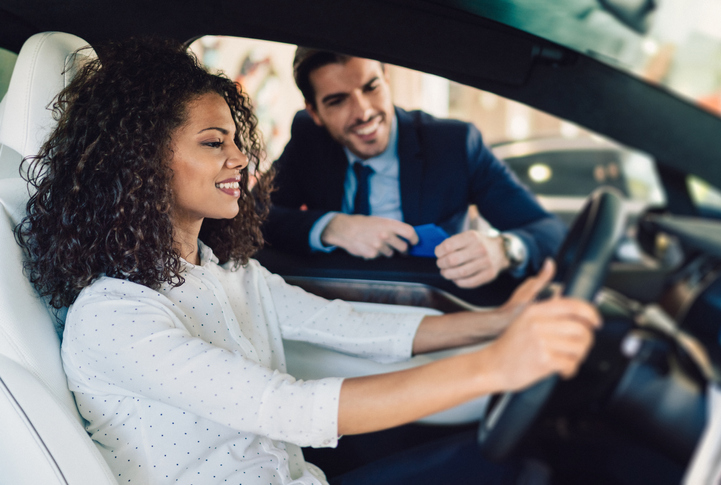 Woman Shopping in Car Dealership