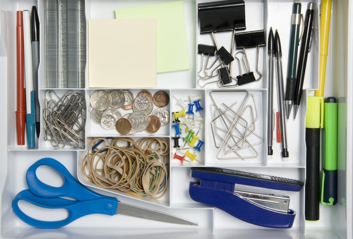 Extra school supplies in a junk drawer.