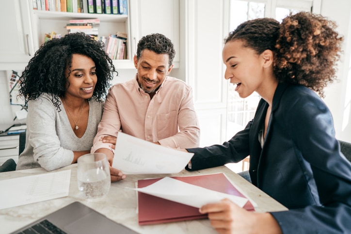 Couple talking with financial advisor