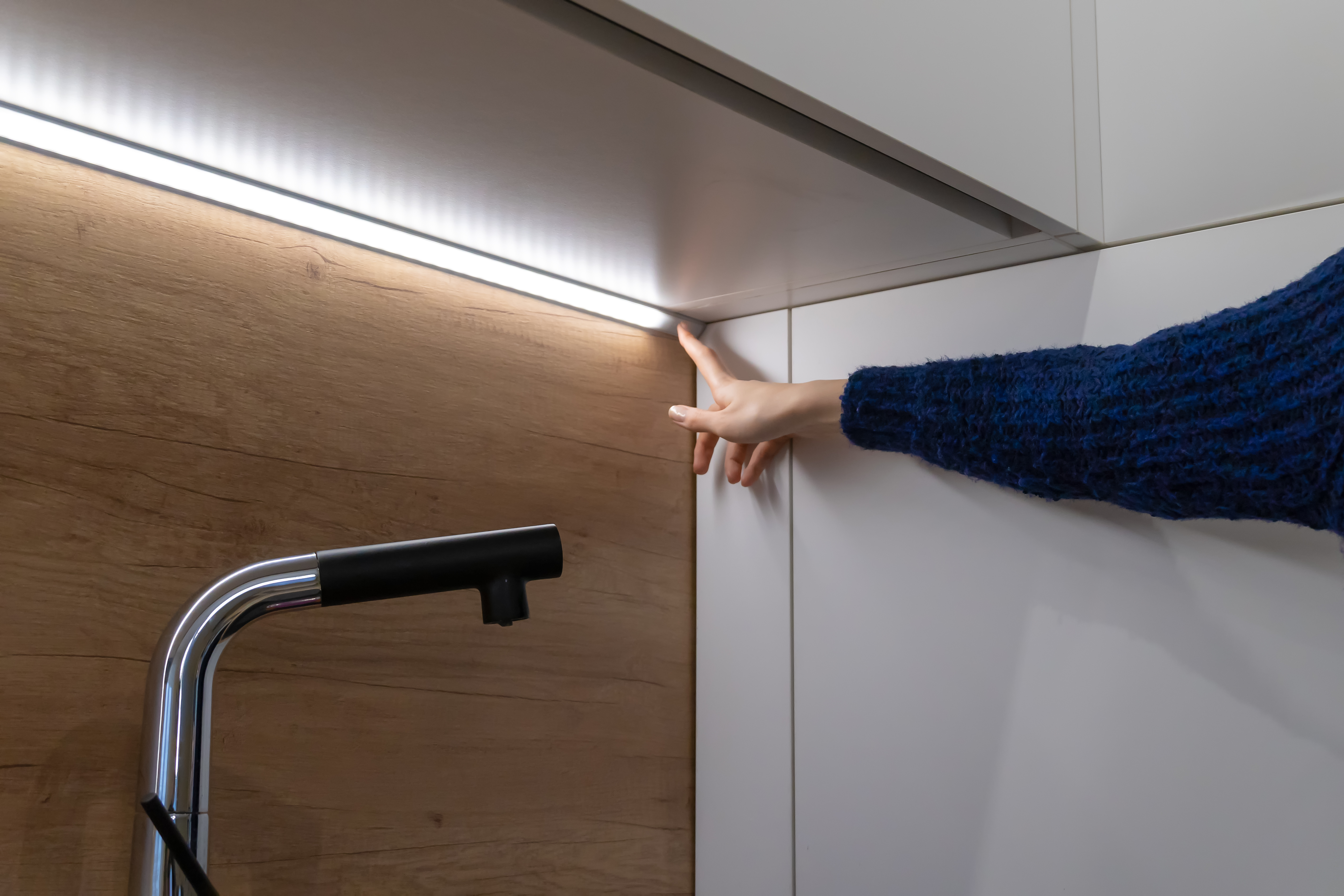 person tapping on the LED Lightstrip