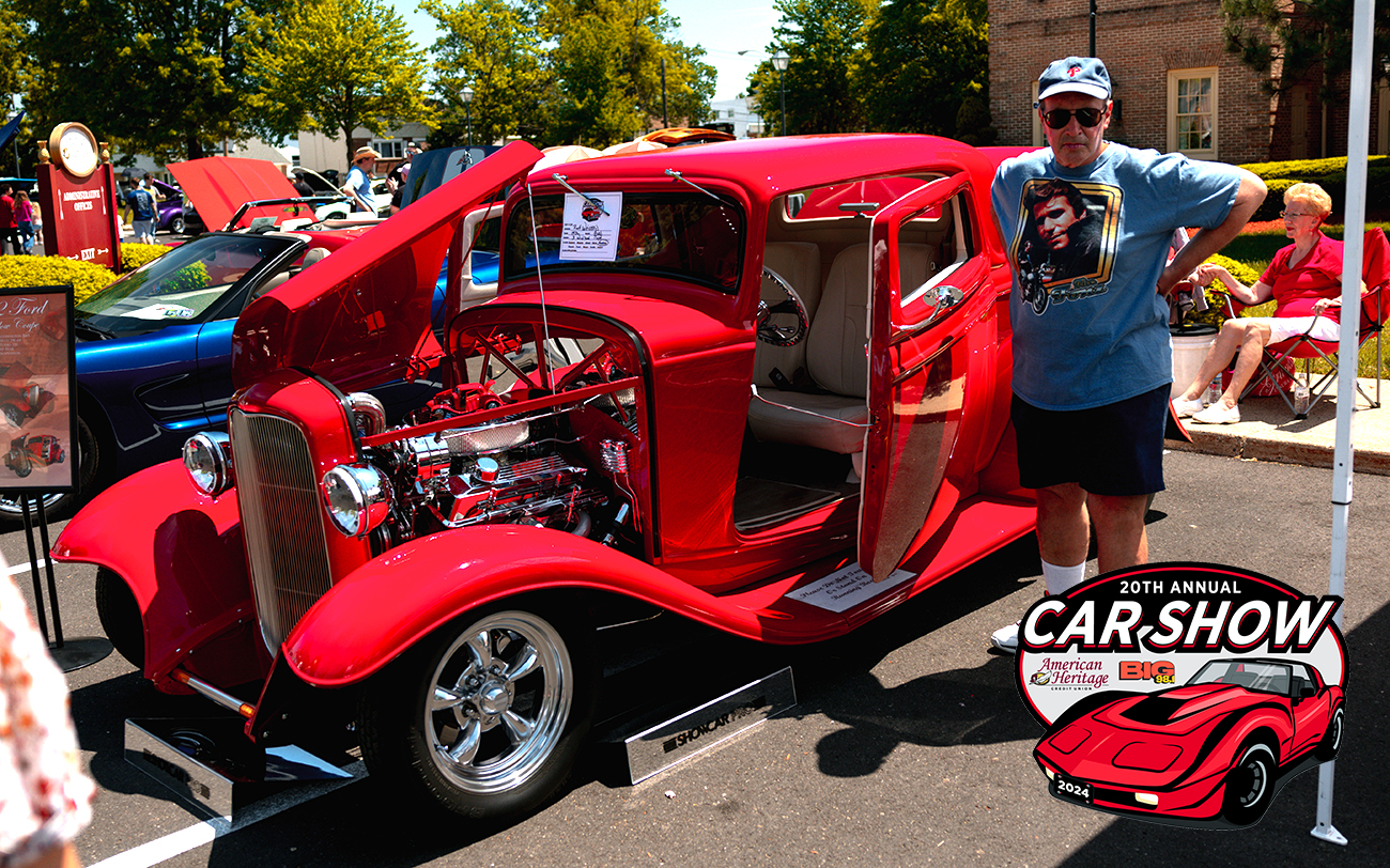 Man stands next to red antique car at American Heritage Credit Union and BIG 98.1's Annual Car Show and Member Appreciation Day