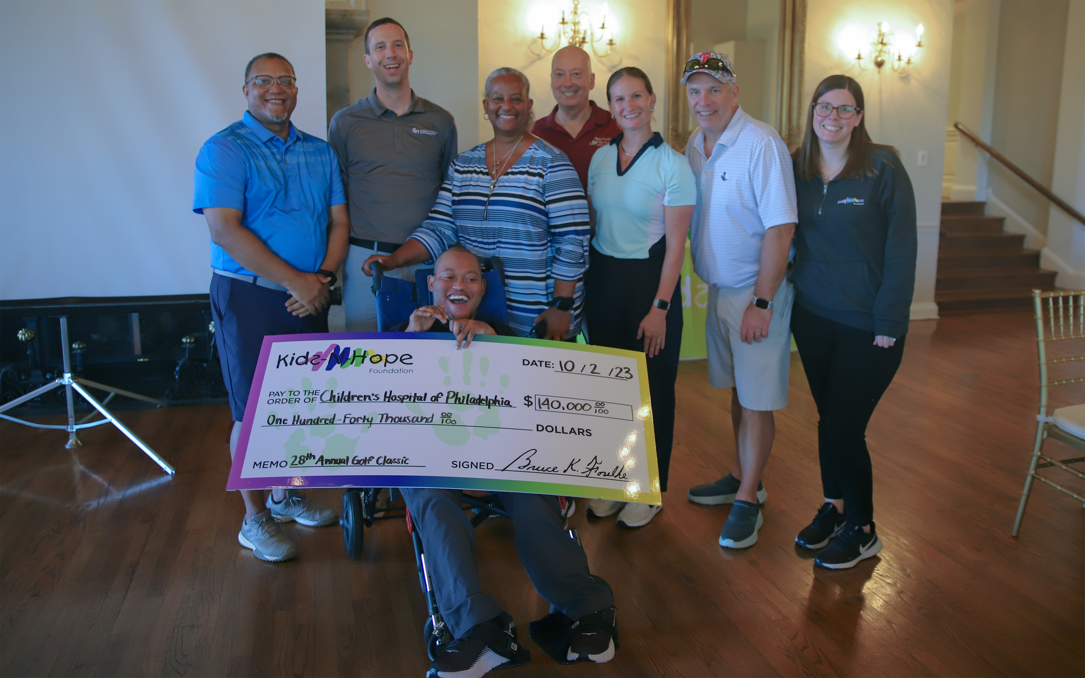 Members of the Kids--Hope Foundation present Children's Hospital of Philadelphia with a check for $140,000 at the 28th annual Kids-N-Hope Golf Classic.