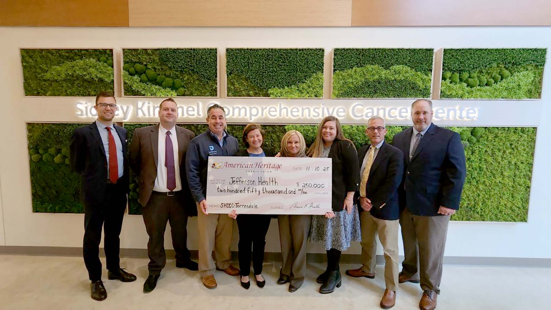 A check is presented to Jefferson Health from American Heritage Credit Union