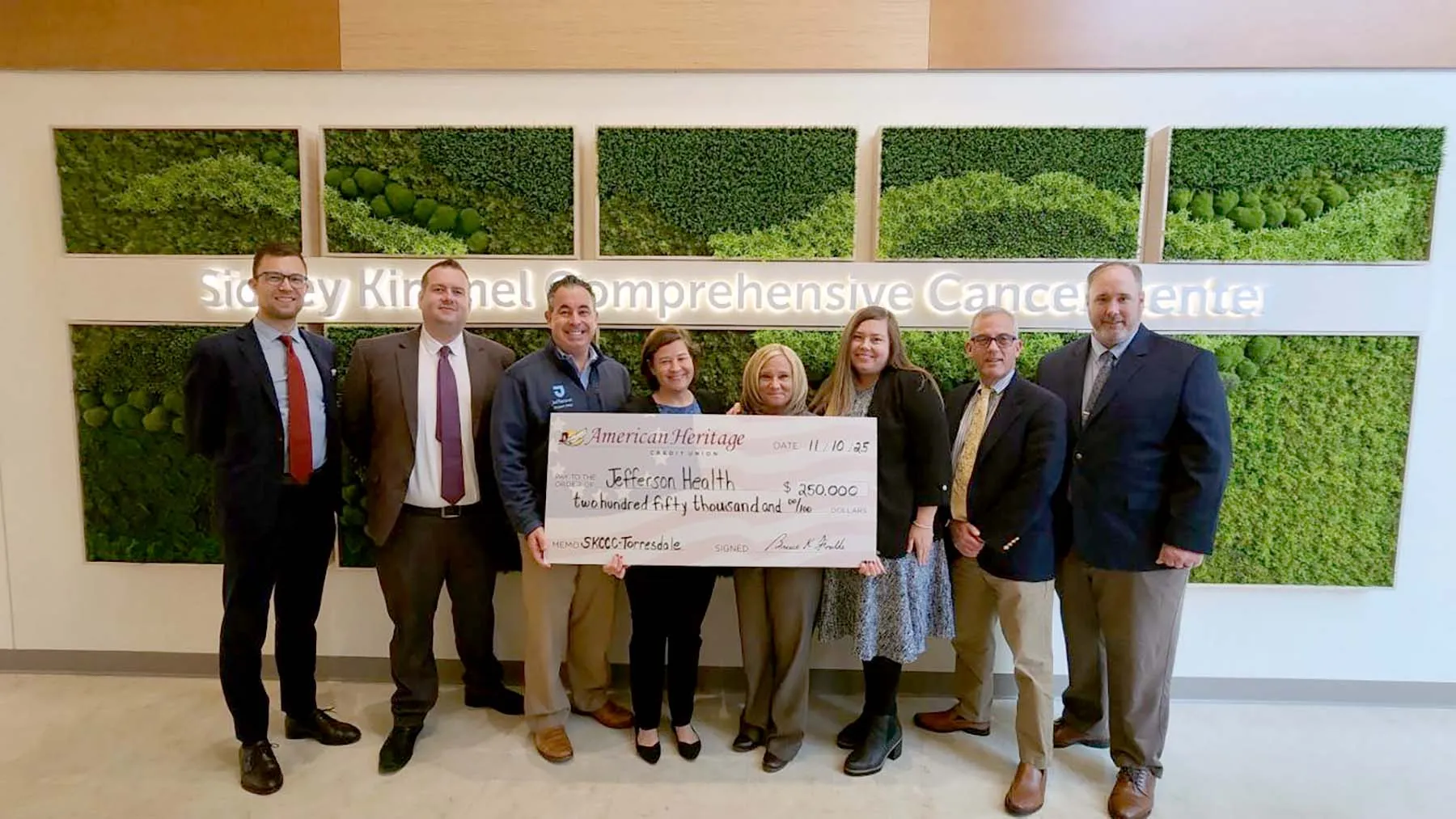 A check is presented to Jefferson Health from American Heritage Credit Union