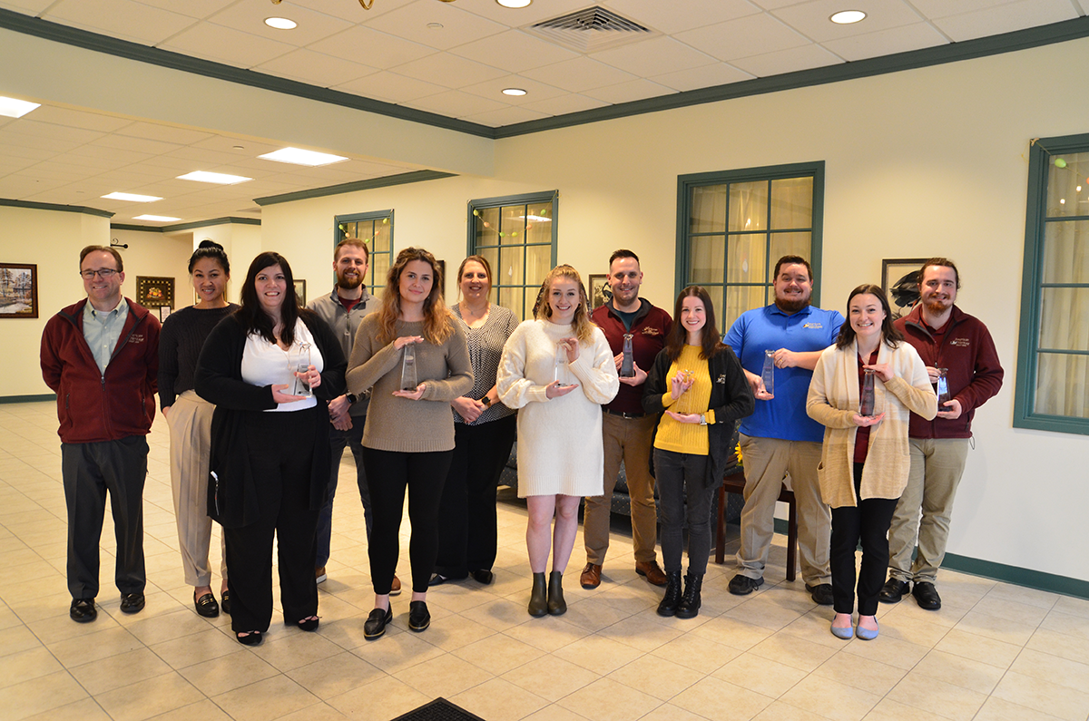 American Heritage Marketing Team Members Display 8 CUNA Diamond Awards.